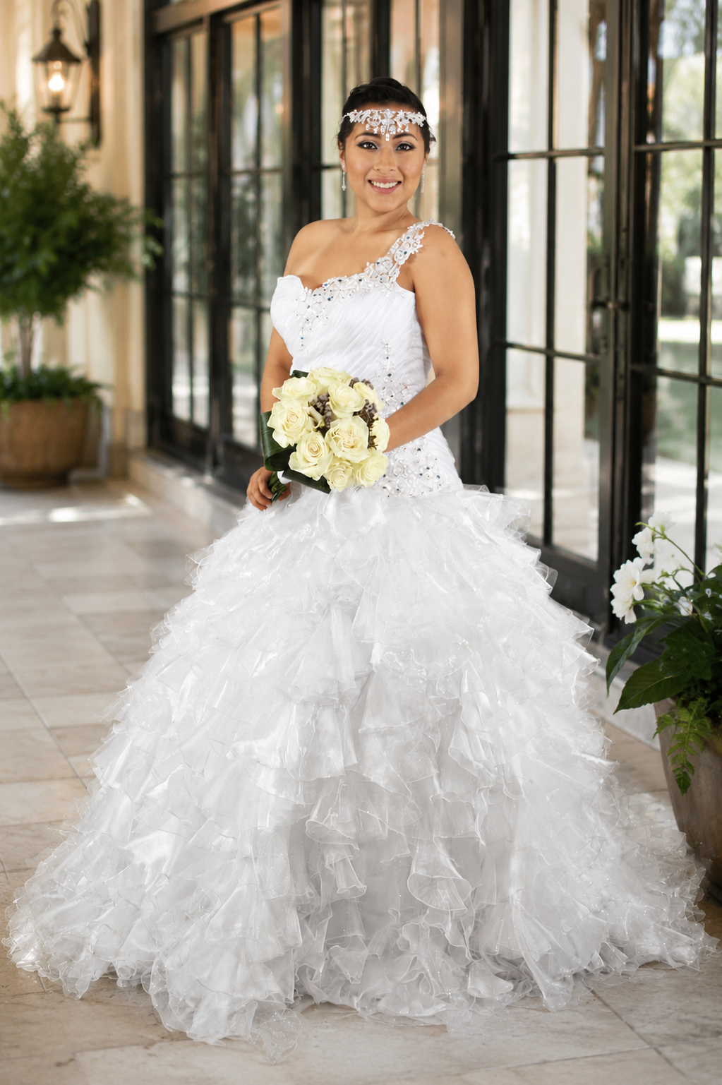 Full-length bridal portrait in a detailed wedding gown